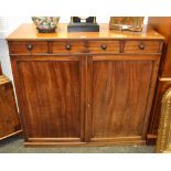 A Victorian mahogany sideboard, two short drawers, turned handles, above fielded panel doors, c.