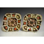 A pair of Royal Crown Derby 1128 pattern shaped square dish, pierced acorn handles, conforming feet,