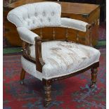 A Victorian mahogany salon side chair, buttoned back, upholstered arms and seat, turned legs, c.