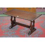 An oak Jaycee coffee table, trestle base with lyre shaped supports. 46cm high x 90cm x 46.5cm.