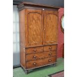 A George III mahogany linen press, outswept cornice,