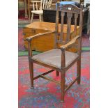 An Arts and Crafts oak elbow chair, c.