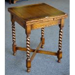 A reproduction oak drawleaf kitchen table, of small proportions.