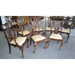 A set of seven Chippendale style mahogany dining chairs, including two carvers, drop in seats,