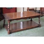 A large oak Jaycee coffee table, rectangular moulded top, spreading turned supports, undertier,