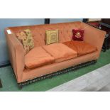 An early 20th century three seat settee, high back and sides,