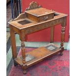 An oak stick stand in the Gothic taste, carved back,