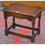 An oak Jaycee occasional table, rectangular top, shaped frieze, turned supports.