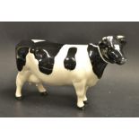 A Beswick Fresian cow, ch "Claybury Legwater", designed by Arthur Gredington, model no 1326A,