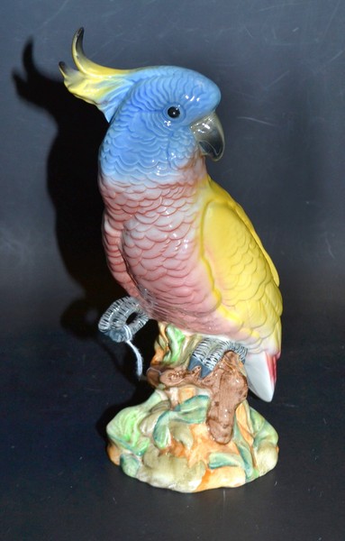 A Beswick model of a Cockatoo, number 1180, glazed in yellow and blue,