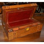 A Victorian walnut and marquetry writing slope with leather writing surface and fitted compartments.