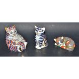 A Royal Crown Derby paperweight, Catnip kitten; others, playful cub and seated kitten,