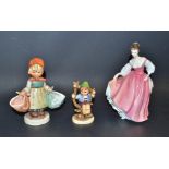 A Goebel figure, large, girl with baskets; another, Apple Tree boy; a Royal Doulton figure,