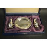 A silver two piece cruet set on oval tray stand, Carrs, Sheffield 2000,