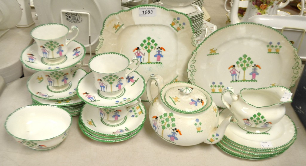 A Paragon cross stitch pattern part dinner service including bread and butter plates, cups ,saucers,