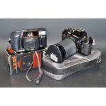 Cameras - a Nikon F301 SLR camera body, 28-200mm zoom lens, etc.