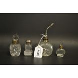 A Victorian silver mounted cut glass scent bottle; others;