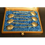 A set of six continental silver gilt spoons, engraved bowl backs, stamped 84, spiralled hafts,
