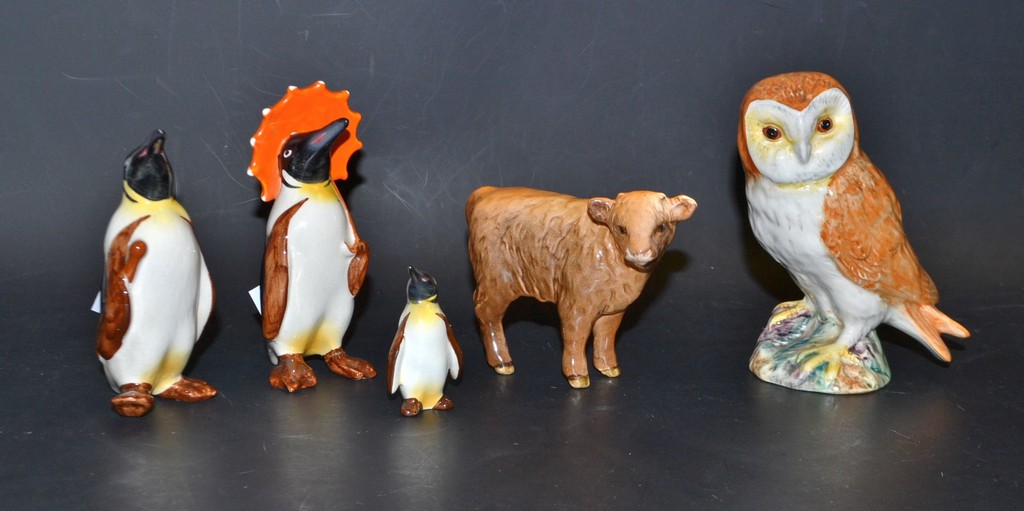 Beswick - A three piece Penguin family; a Highland calf;