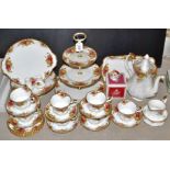 A Royal Albert Old country roses tea service comprising a three tier cake stand, a footed tazza,