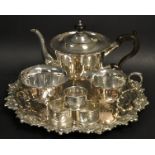 A three piece plated tea service on a circular tray; a pair of silver napkin rings,