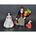 A Royal Doulton figure The Old Balloon Man Hn 1954; another Gail M212;