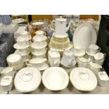 A Royal Doulton Gold Concord coffee and dinner service, comprising 19 cups, 16 saucers,