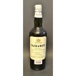 A bottle of Black and White special blend of Buchanan`s choice old scotch whiskey.