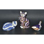 A Royal Crown Derby paperweight, a cat; others, Arctic Fox and Wren,
