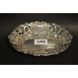 A Victorian pierced silver shaped oval dish, embossed with flowers and scrolls,