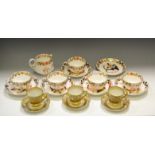 A Crown Derby Porcelain part tea service, comprising five teacups, six saucers and milk jug,