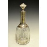 An early 20th century silver coloured metal mounted mallet shaped decanter