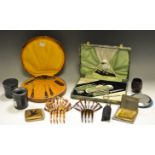 Ladies Ephemera - a faux tortoiseshell comb, another; a cased bakelite manicure set,