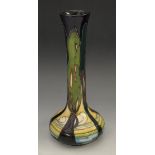 A contemporary Moorcroft New Dawn pattern slender elongated bottle vase,