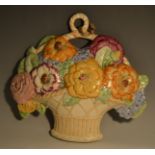 A Beswick wall plaque, in the form of a basket of colourful flowers, 28cm high, printed marks,