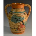 A Clarice Cliff two-handled lotus vase, decorated with an orange roof cottage and trees,