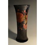 A Moorcroft Pomegranate pattern flared cylindrical vase, tube lined with large fruit,