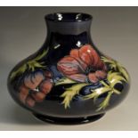 A large contemporary Moorcroft Anemone pattern compressed ovoid vase,