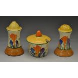 A Clarice Cliff Bizarre Crocus pattern three piece cruet set, brightly decorated with crocuses,