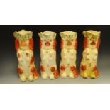 Three Staffordshire Spaniel jugs, rust markings, the rims with vine and berries, c.