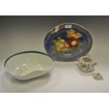 A Royal Doulton shaped oval dish, decorated with flowers on a blue ground,