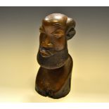 A North African carved tribal bust, Muguba, bearded warrior,