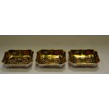 A set of three Royal Crown Derby 1128 shaped rectangular trinket dishes, sold gold banded,