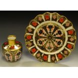A Royal Crown Derby 1128 shaped circular wavy edge plate, 22cm wide; a 1128 vase,