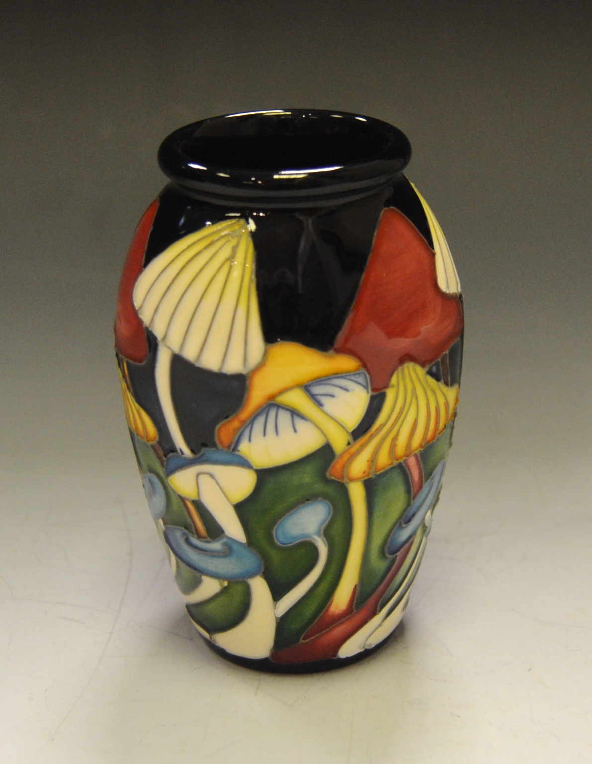 A Moorcroft vase, decorated with mushrooms,