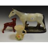 A continental model of a Horse c 1920; a red glazed pottery model of a Boxer dog;