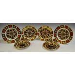 A pair of Royal Crown Derby 1128 Imari tea cups, saucers and tea plates,