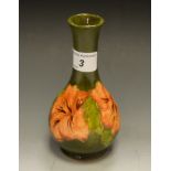 A Moorcroft Hibiscus pattern globular vase, green ground,