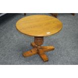 A circular oak occasional table by Mellow Craft furniture