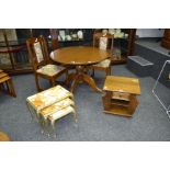 A reproduction circular oak and mahogany dining table ;